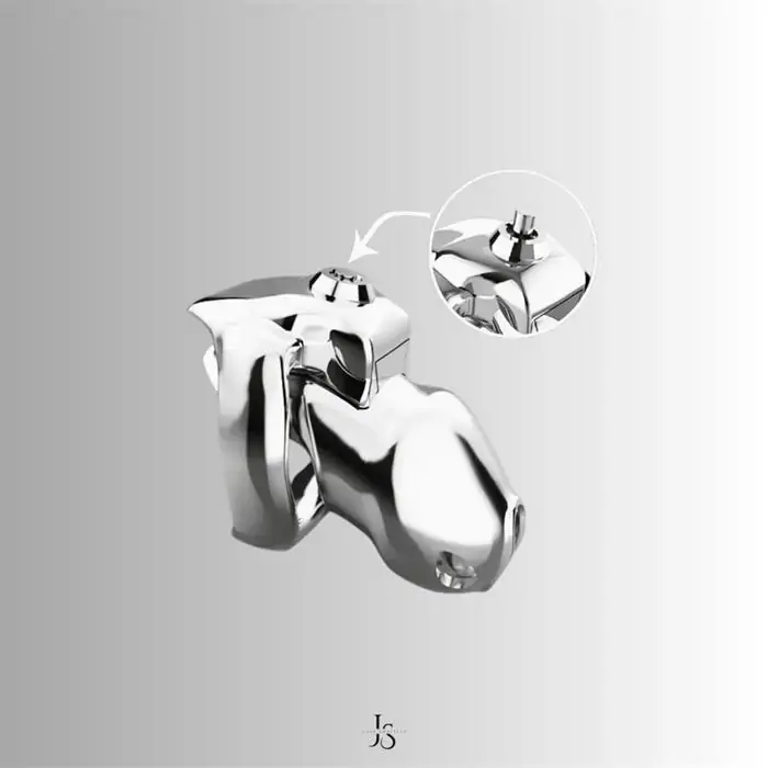 Close-up of stainless steel chastity cage showing smooth finish and locking detail